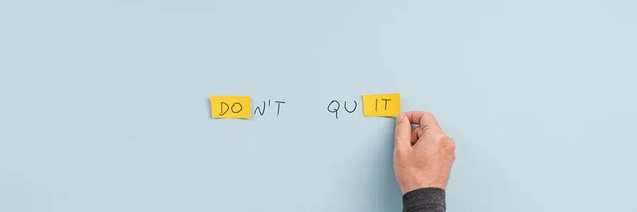 The words "Don't Quit" on a blue background.