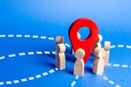 Local SEO concept with wooden figures around a red location pin representing targeted B2B audience