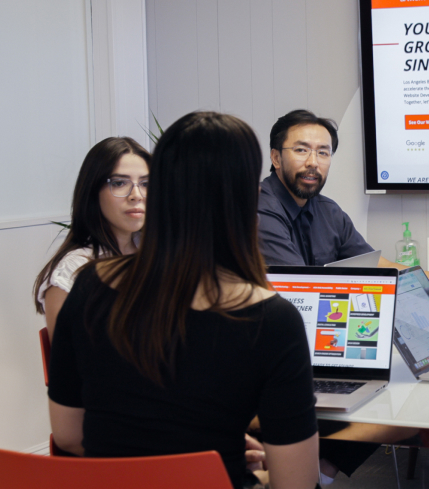 Ready artwork marketing agency monrovia team members emily au, victor huynh, steffanie rodriguez, michael chan strategizing about client success in monrovia office meeting room