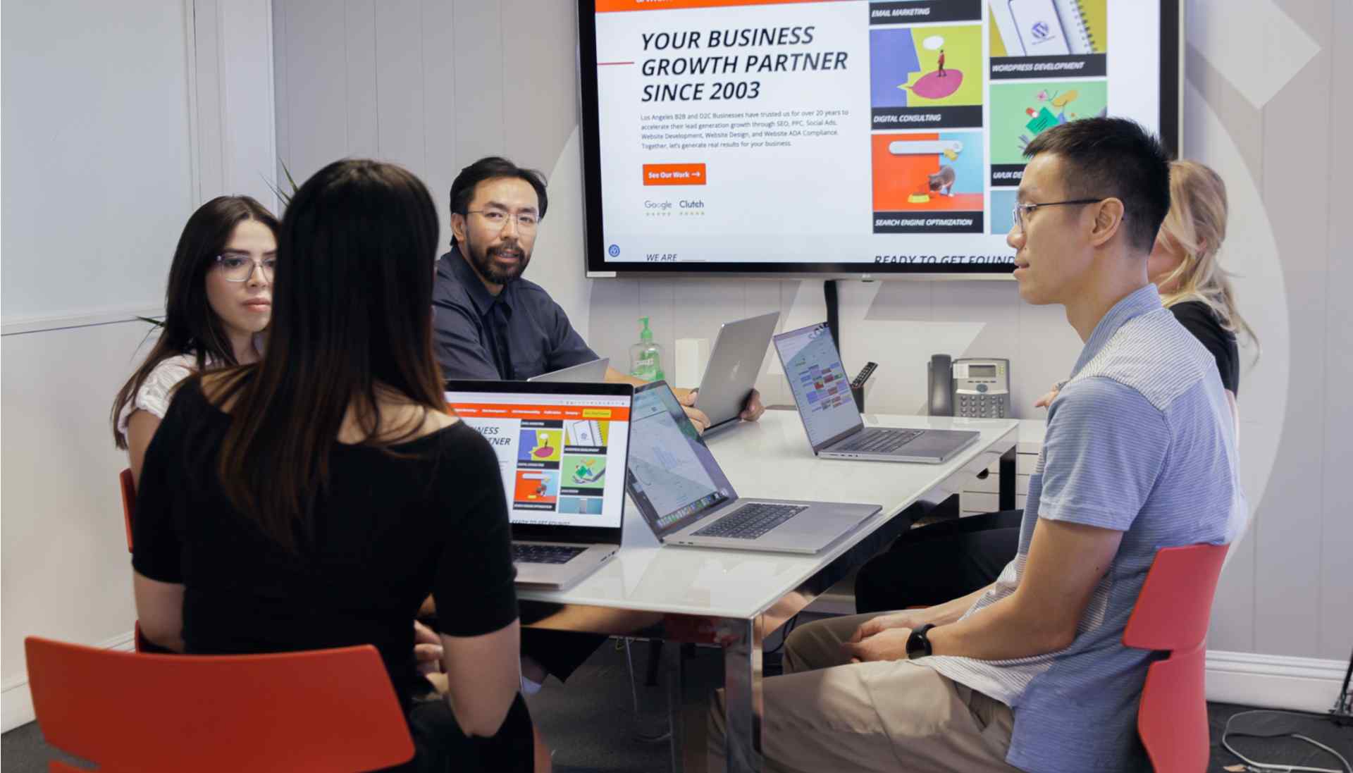 Ready artwork marketing agency monrovia team members emily au, victor huynh, steffanie rodriguez, michael chan strategizing about client success in monrovia office meeting room