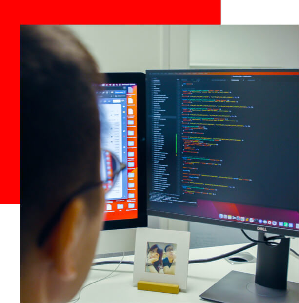 Ready Artwork digital marketing agency los angeles senior web developer Michael looking at computer screen coding for client